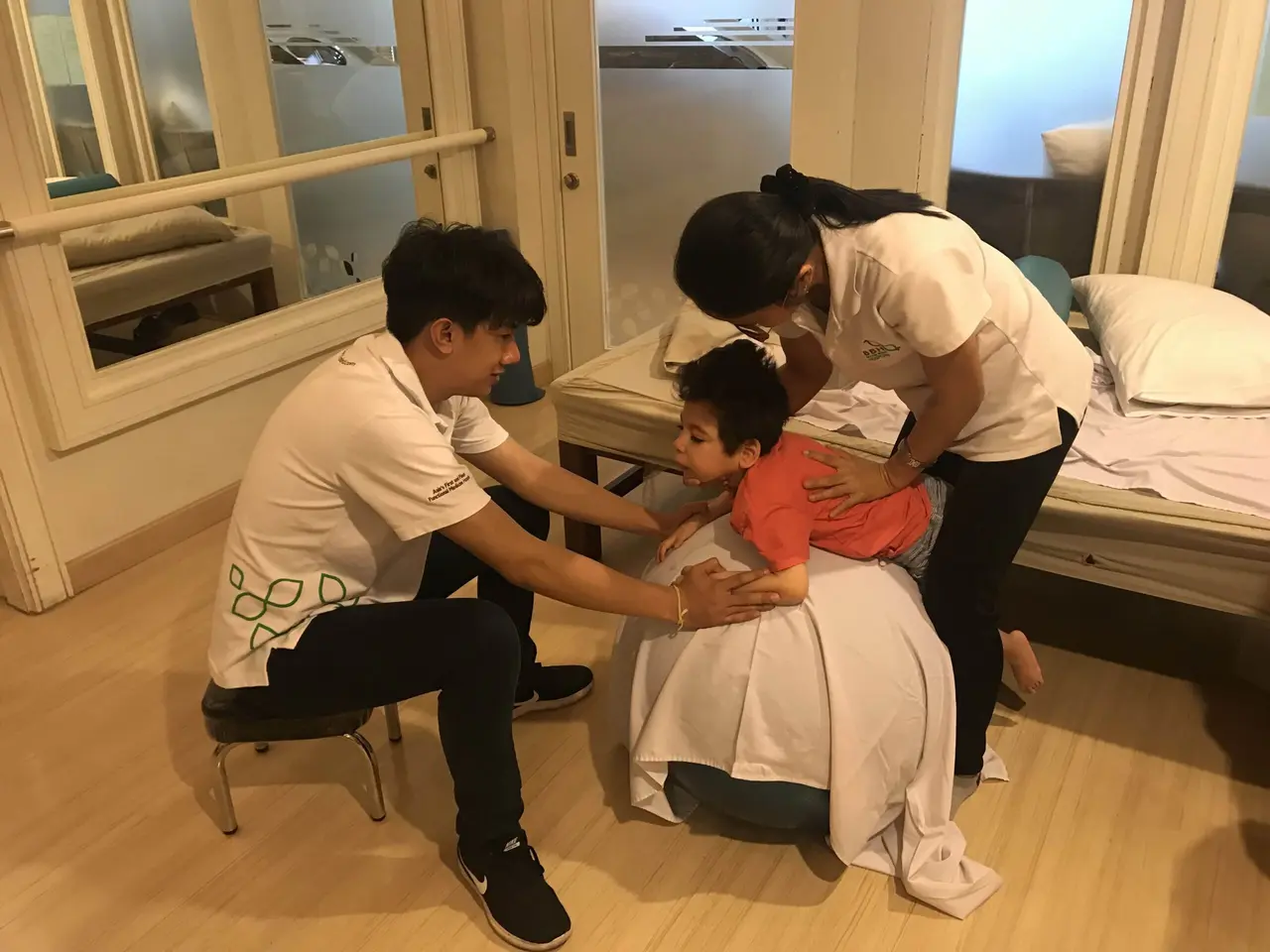 Samuel working on head movement in physical therapy